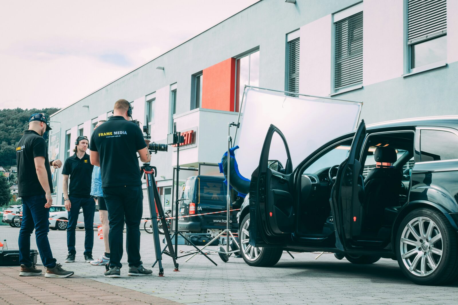 Outdoor commercial production in daylight with professional film crew
